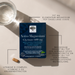 Active Magnesium™ Glycinate 600 mg met glas water en tablet.